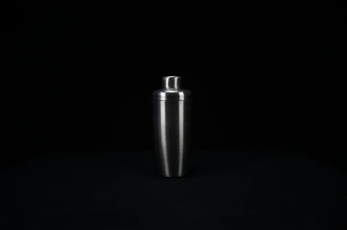 Stainless steel ice mixer machine with rotating blades.