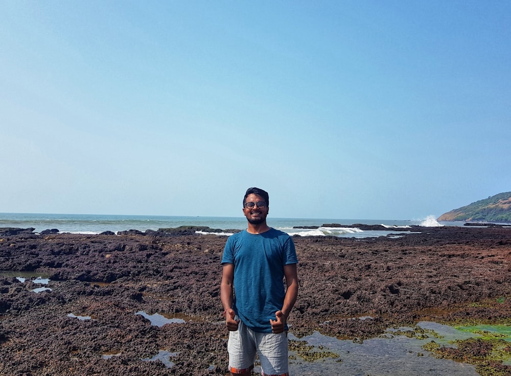 man standing beside beach