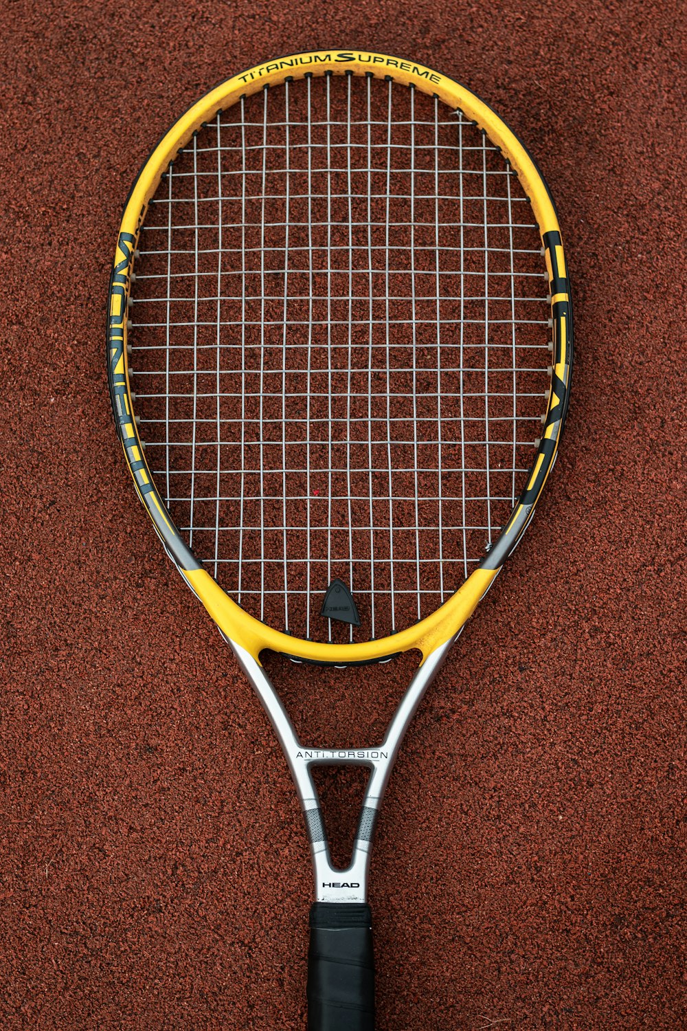 yellow and white badminton racket