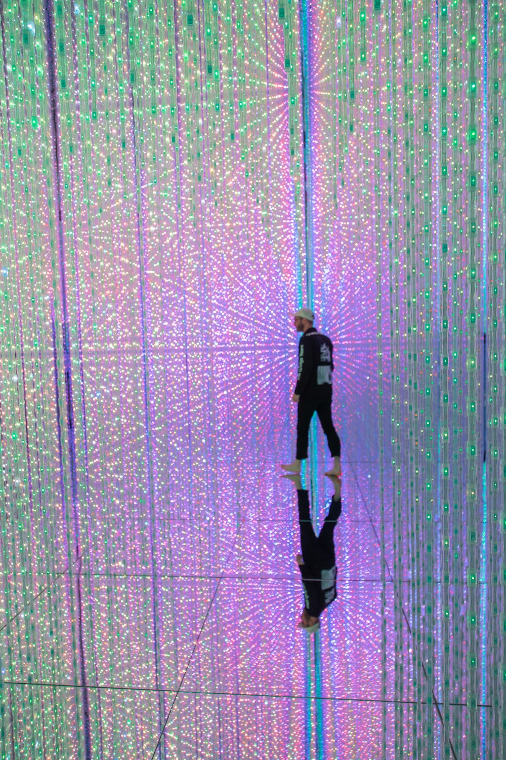 man standing inside lighted room