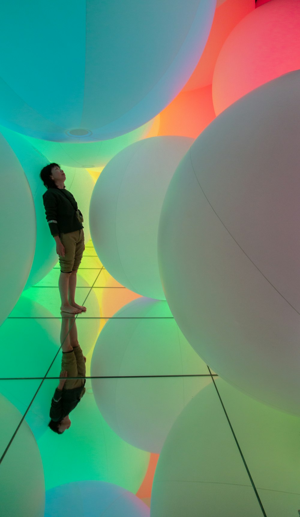 man leaning on paper lantern