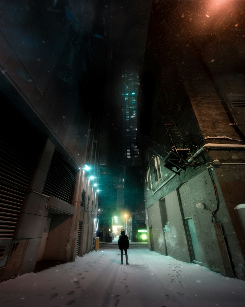 person standing between concrete buildings