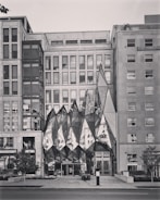 A commercial building with a unique facade and landscaping.