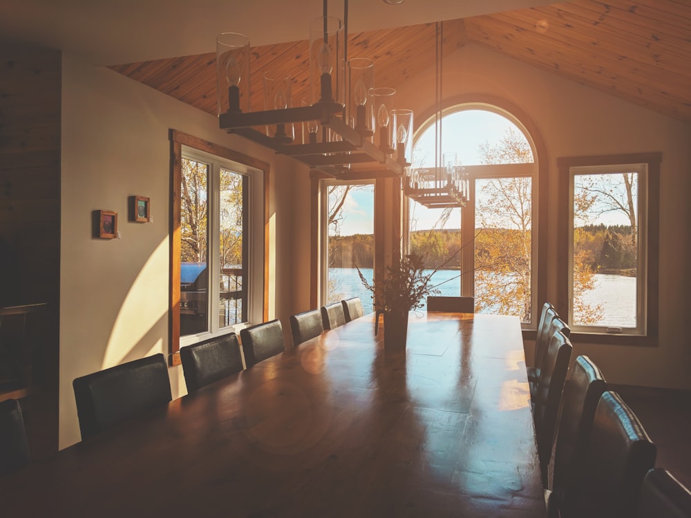 rectangular brown wooden table with chairs