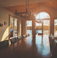 rectangular brown wooden table with chairs