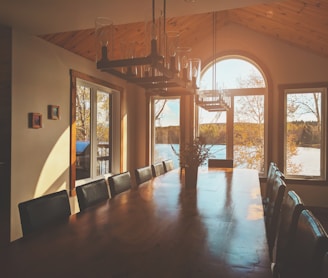 rectangular brown wooden table with chairs