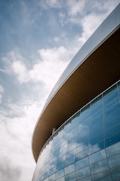 low-angle concrete structure with glass curtain