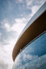 low-angle concrete structure with glass curtain