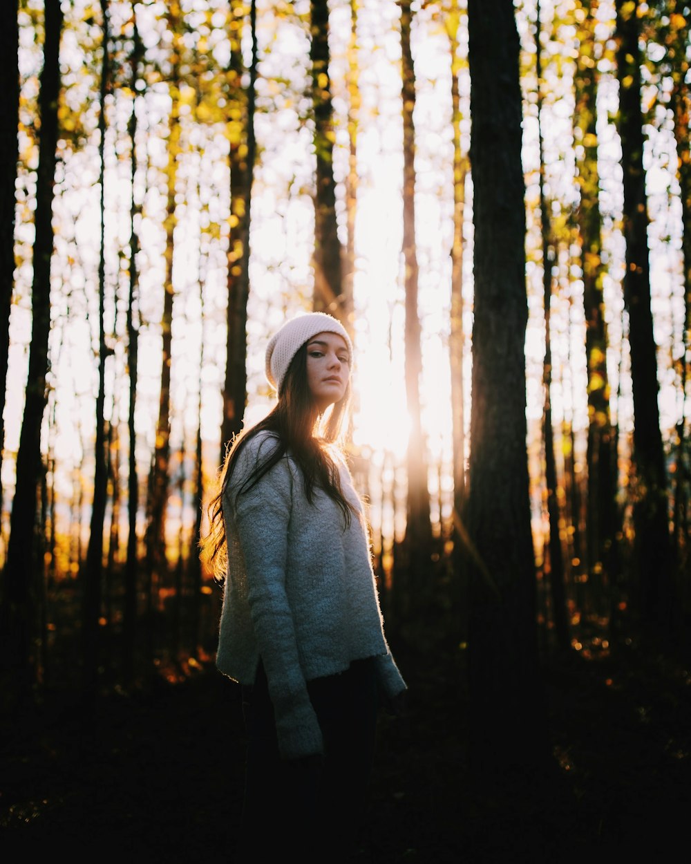 low-light photo of woman on forest