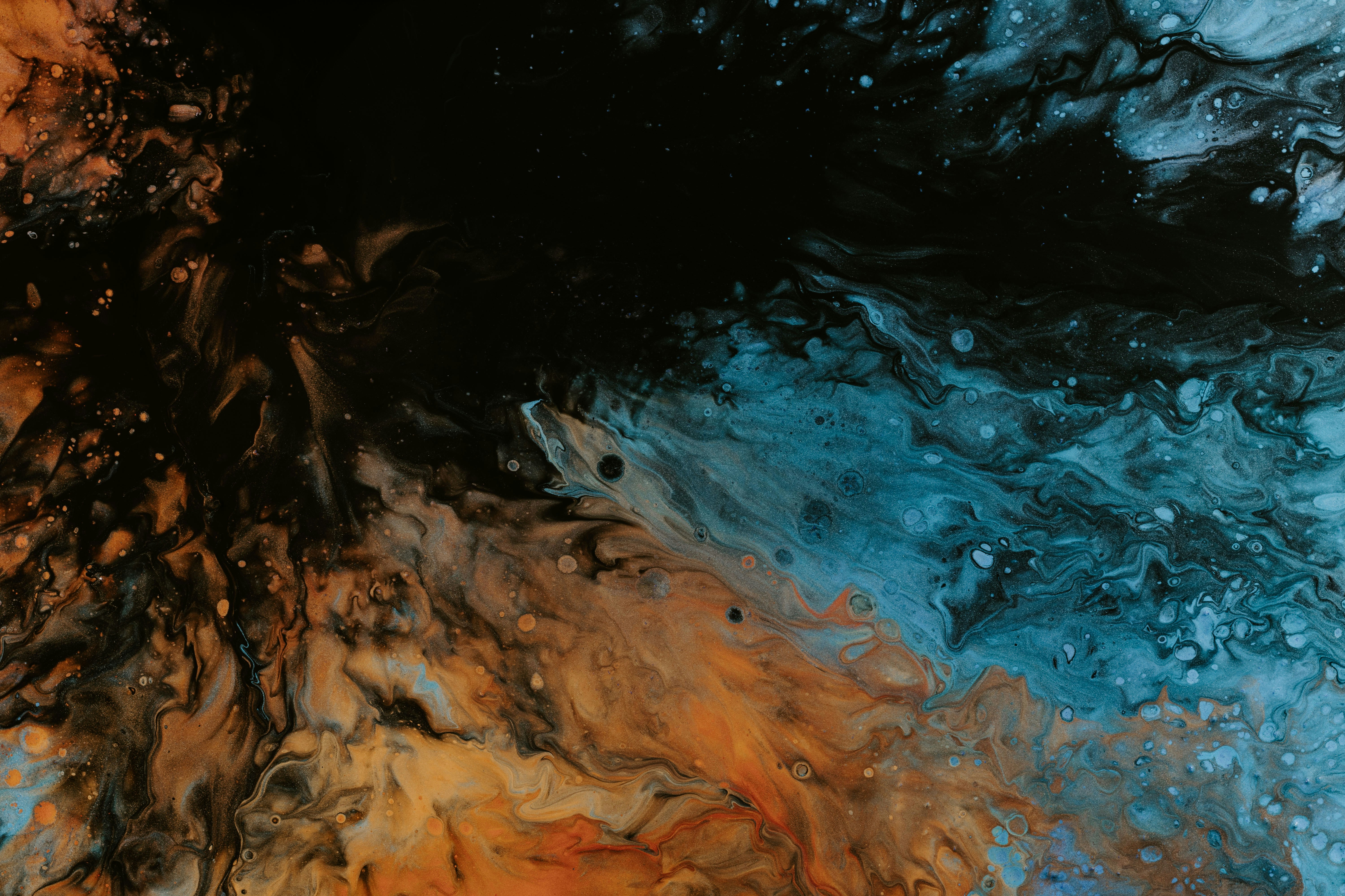 a close up of a blue and orange liquid