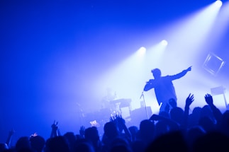 man standing in front of people