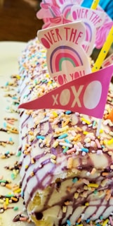 A vibrant cake decorated with colorful frosting and sprinkles.