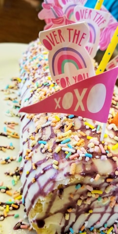 A festive cake adorned with bright icing and playful decorations, ready for a joyful celebration.