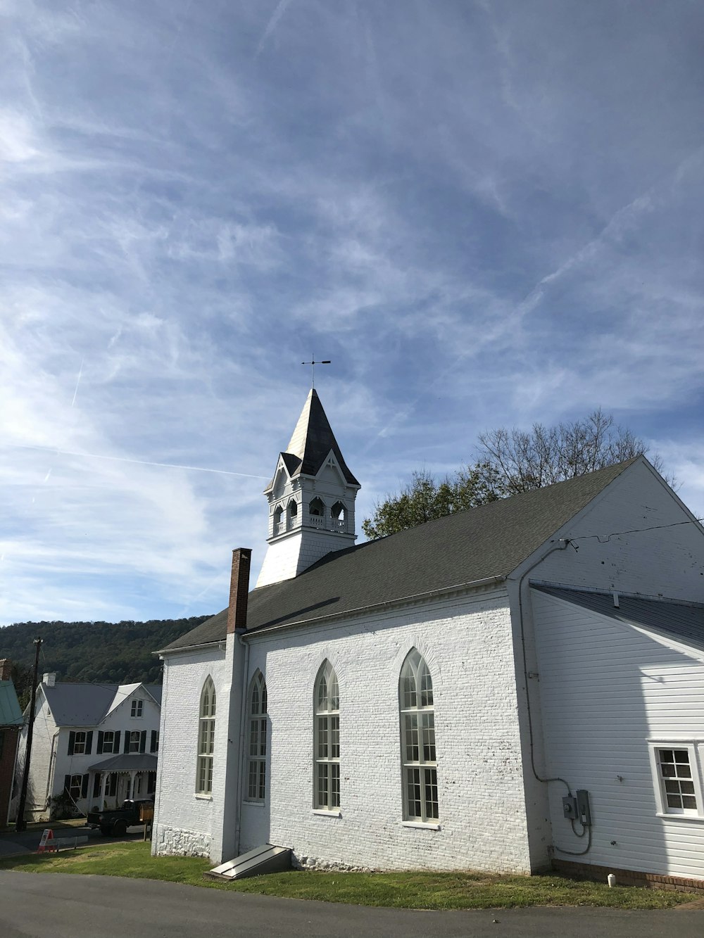 white and gray church near trees