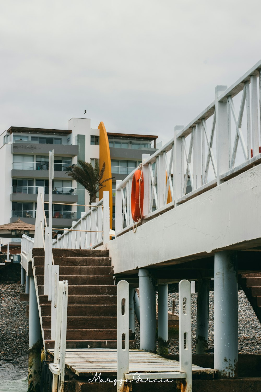 white dock near concrete structure