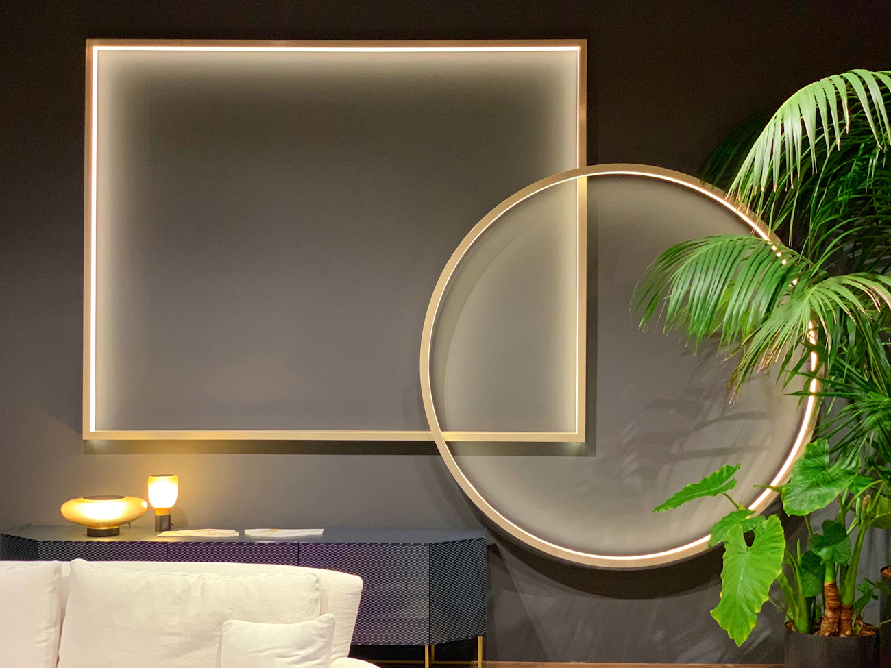 Interior detail featuring a side table, plant, and modern home furnishings