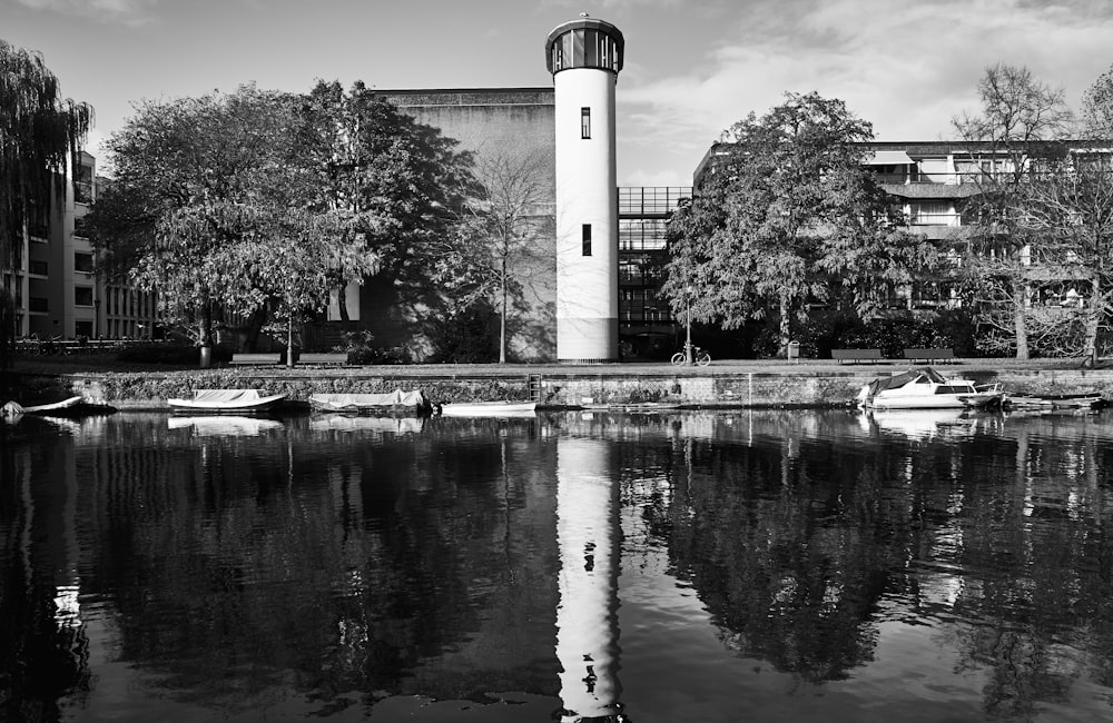 reflection of tower on body of water