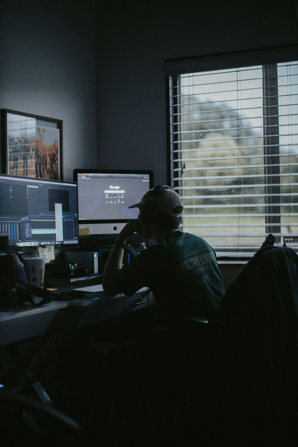 man using computer inside room