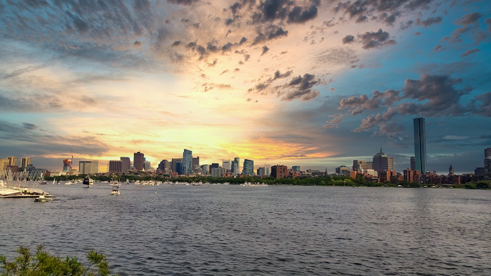 cityscape by water under golden hour