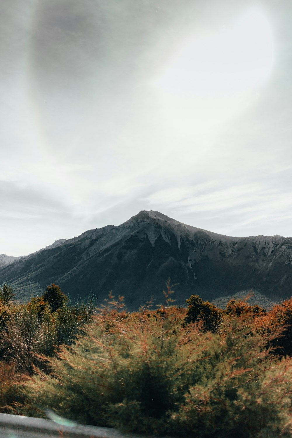 gray mountain under gray sky