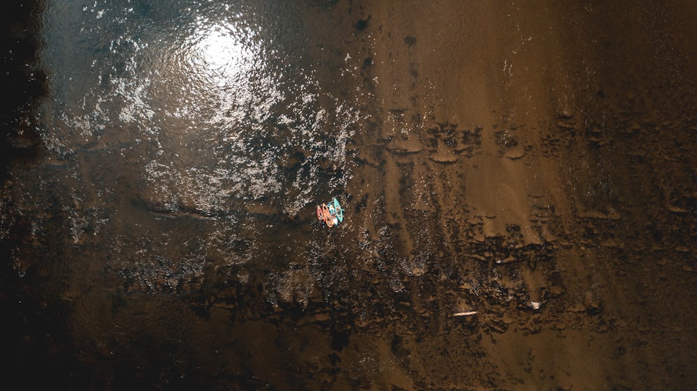 an aerial view of a sandy beach and water