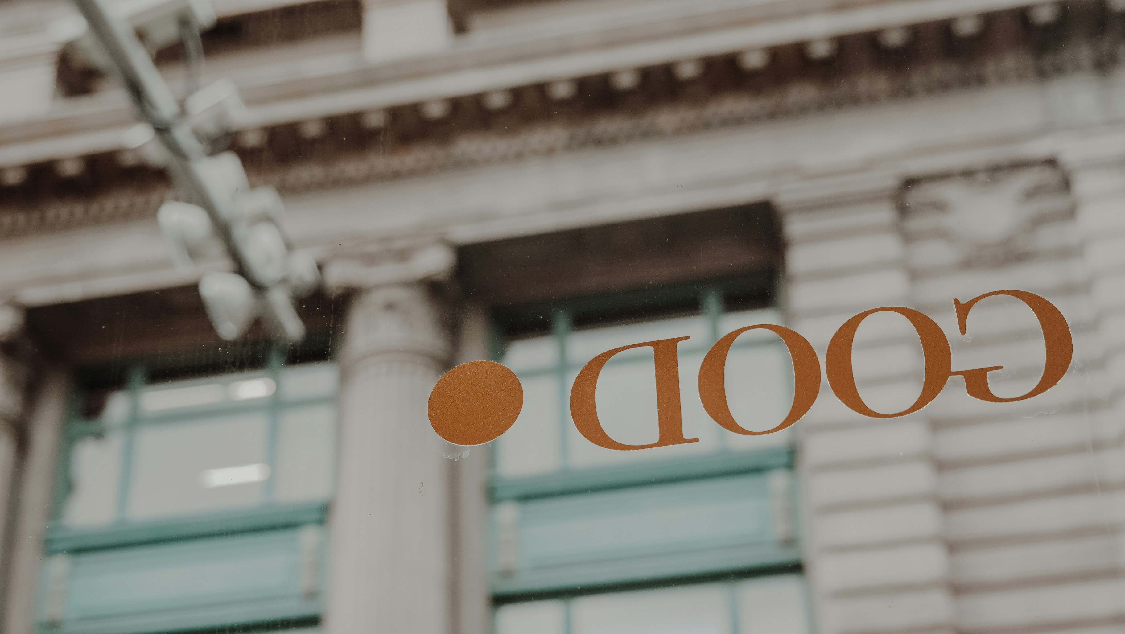 a close up of a street sign with a building in the background