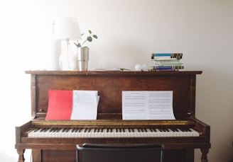 brown wooden spinet piano