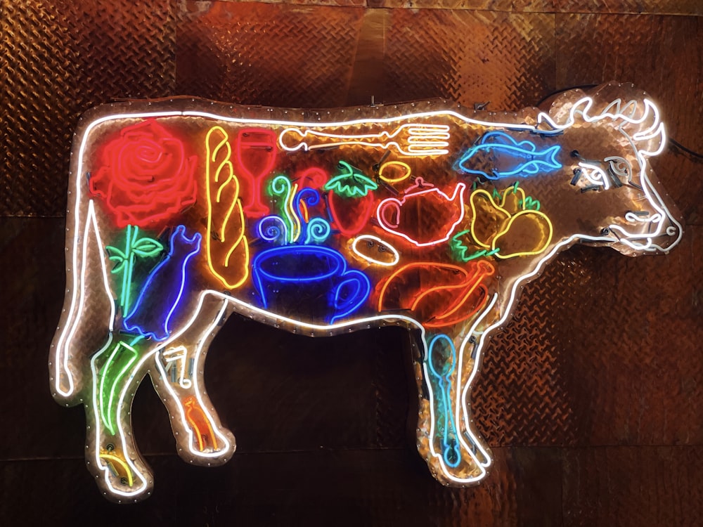 neon light cow decor on wall