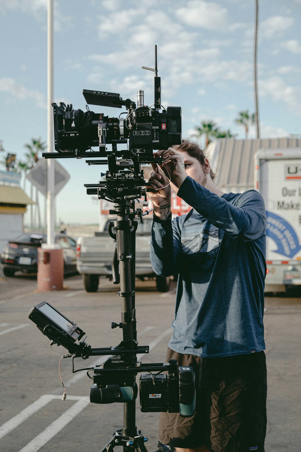 man using professional video camera