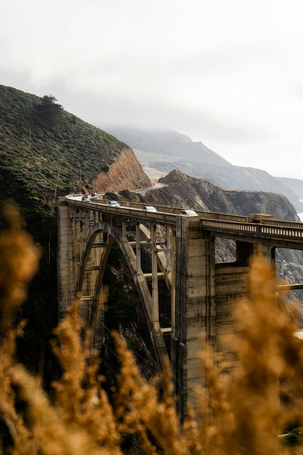 a bridge with a bunch of cars going over it