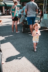 A young boy selling popsicles on a sunny street, symbolizing beginnings and dreams.