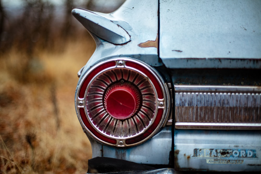 selective focus photo of white and red vehicle bumper