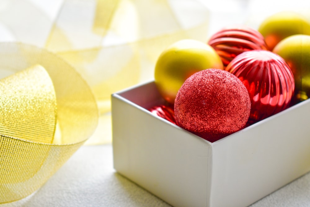 red and brown baubles on box