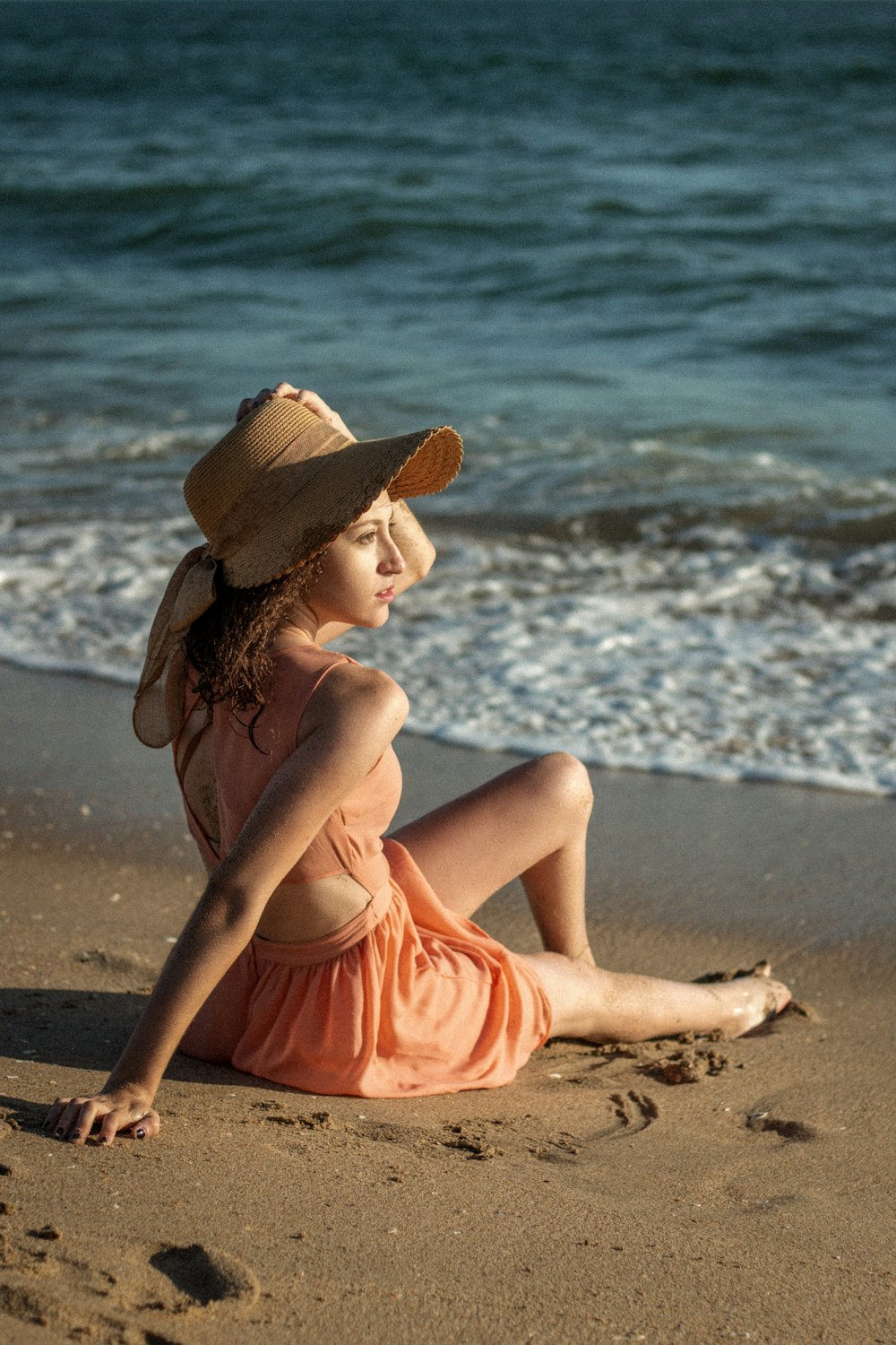 woman sitting on beach