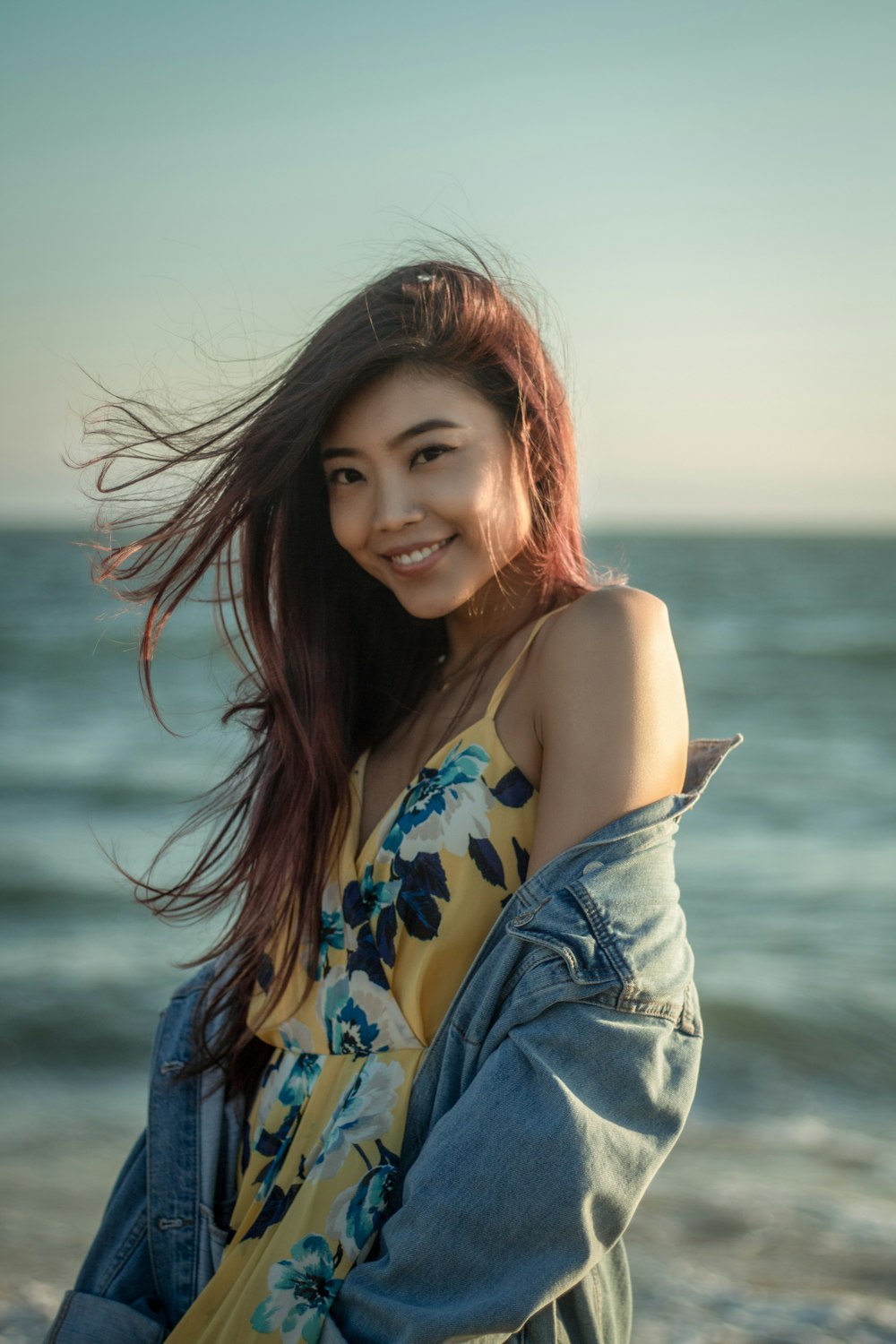 woman wearing gray denim jacket