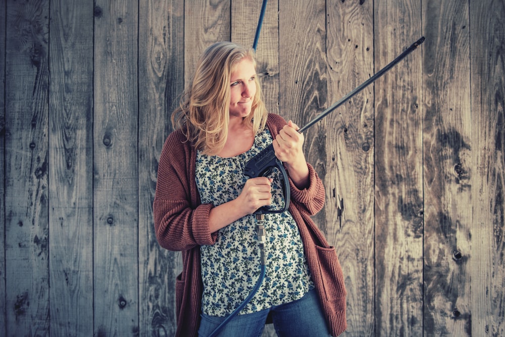 woman standing beside wall