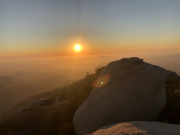 A serene view of the Cuesta rock formations at sunset with soft earthy tones.