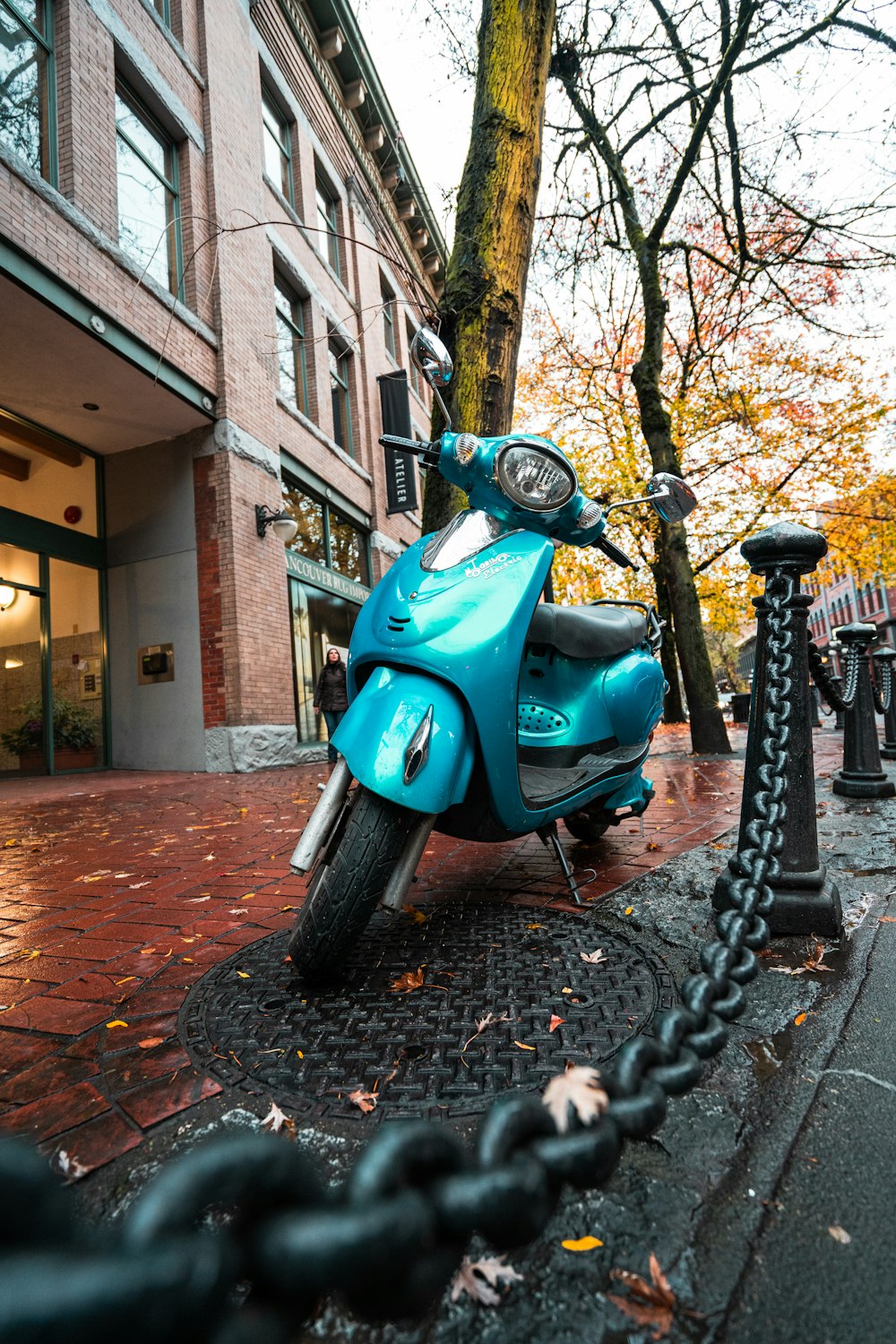 parked blue motor scooter
