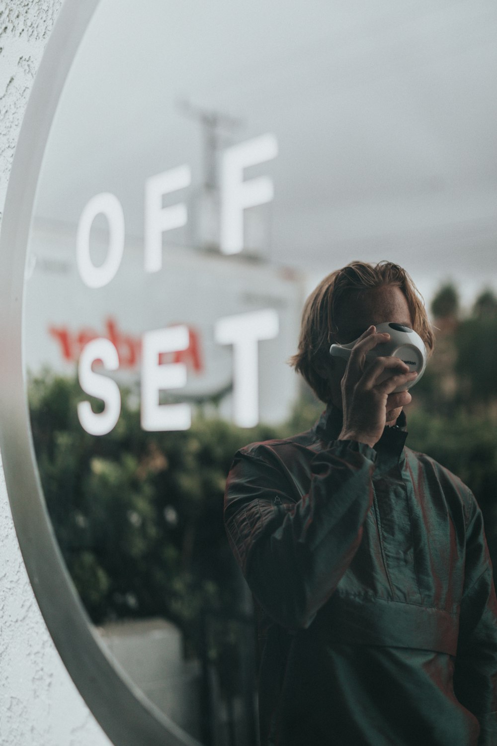 man drinking coffee outside