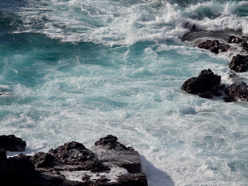 water crashes into the rocks