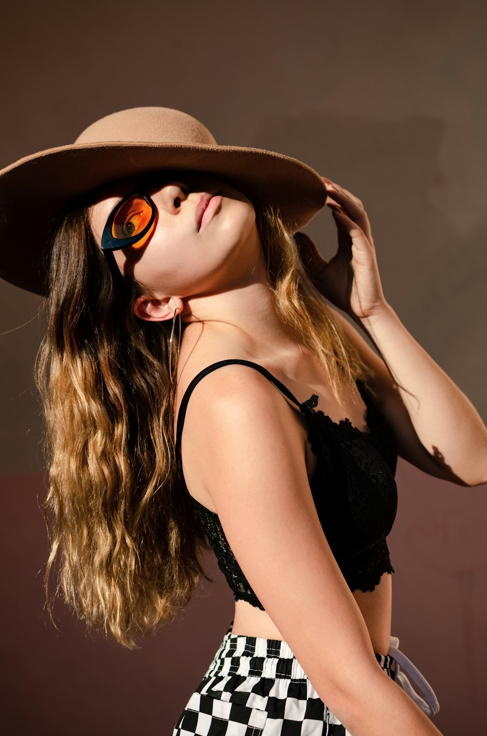 close-up photography of girl wearing brown hat