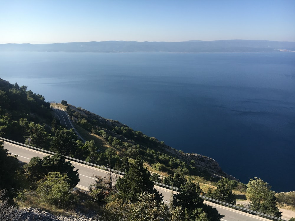 road on hill near sea