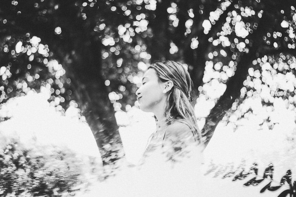 woman standing beside tree