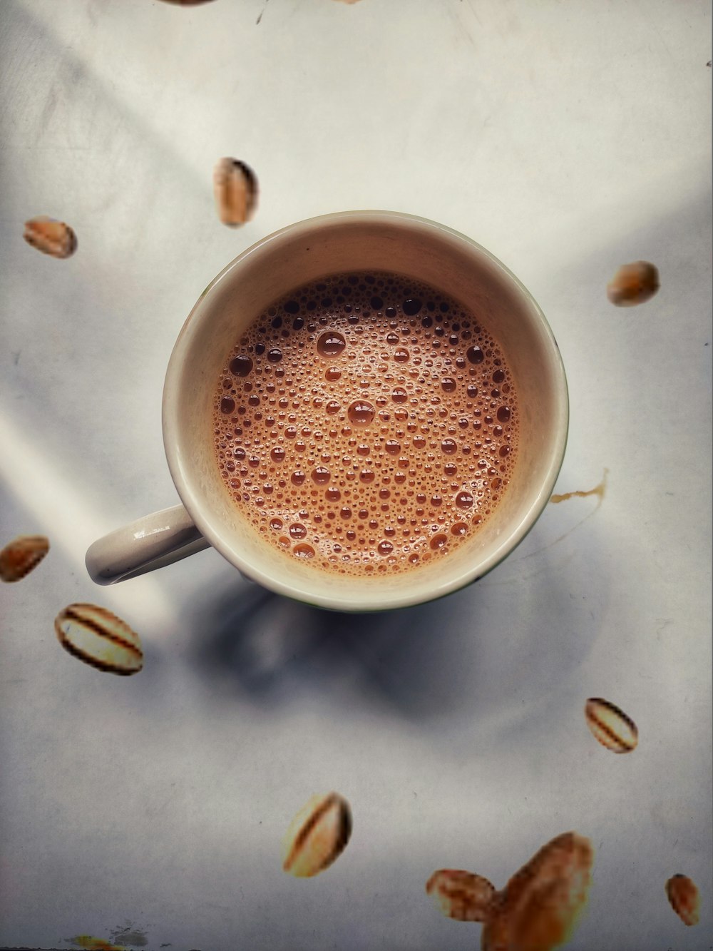 white ceramic mug on hard surface