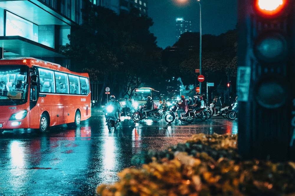 bus running in front of motorcycle riders