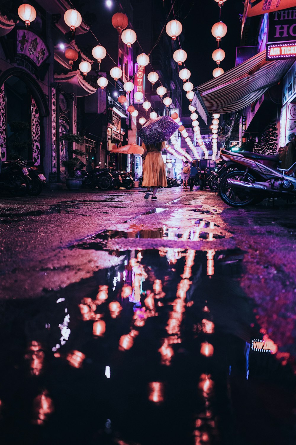 woman under purple umbrella