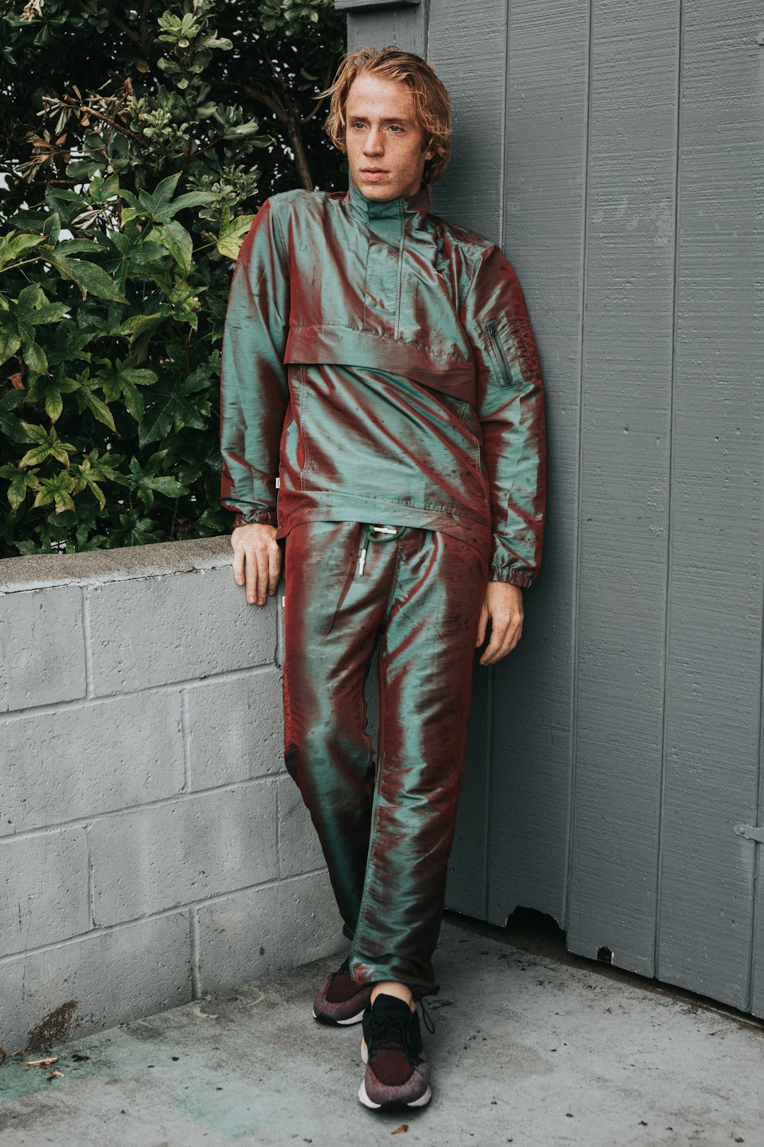 man wearing silk tracksuit