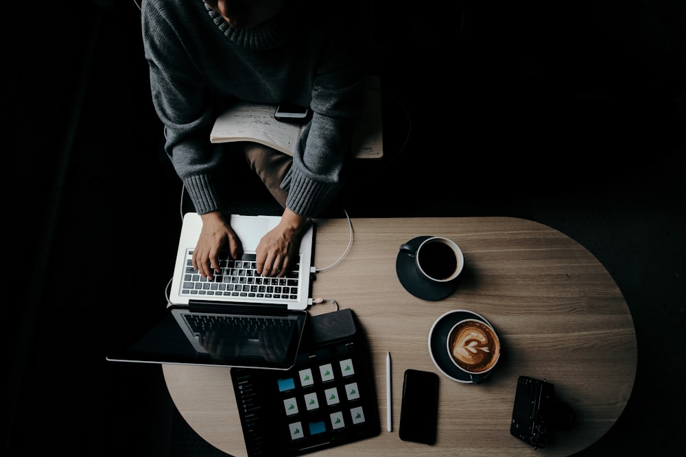 person using grey laptop computer