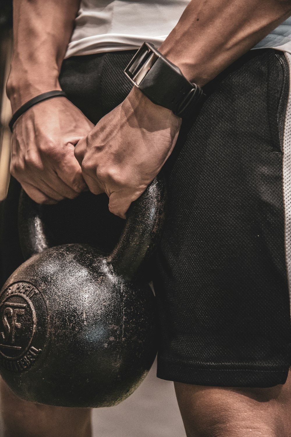 man holding kettlebell