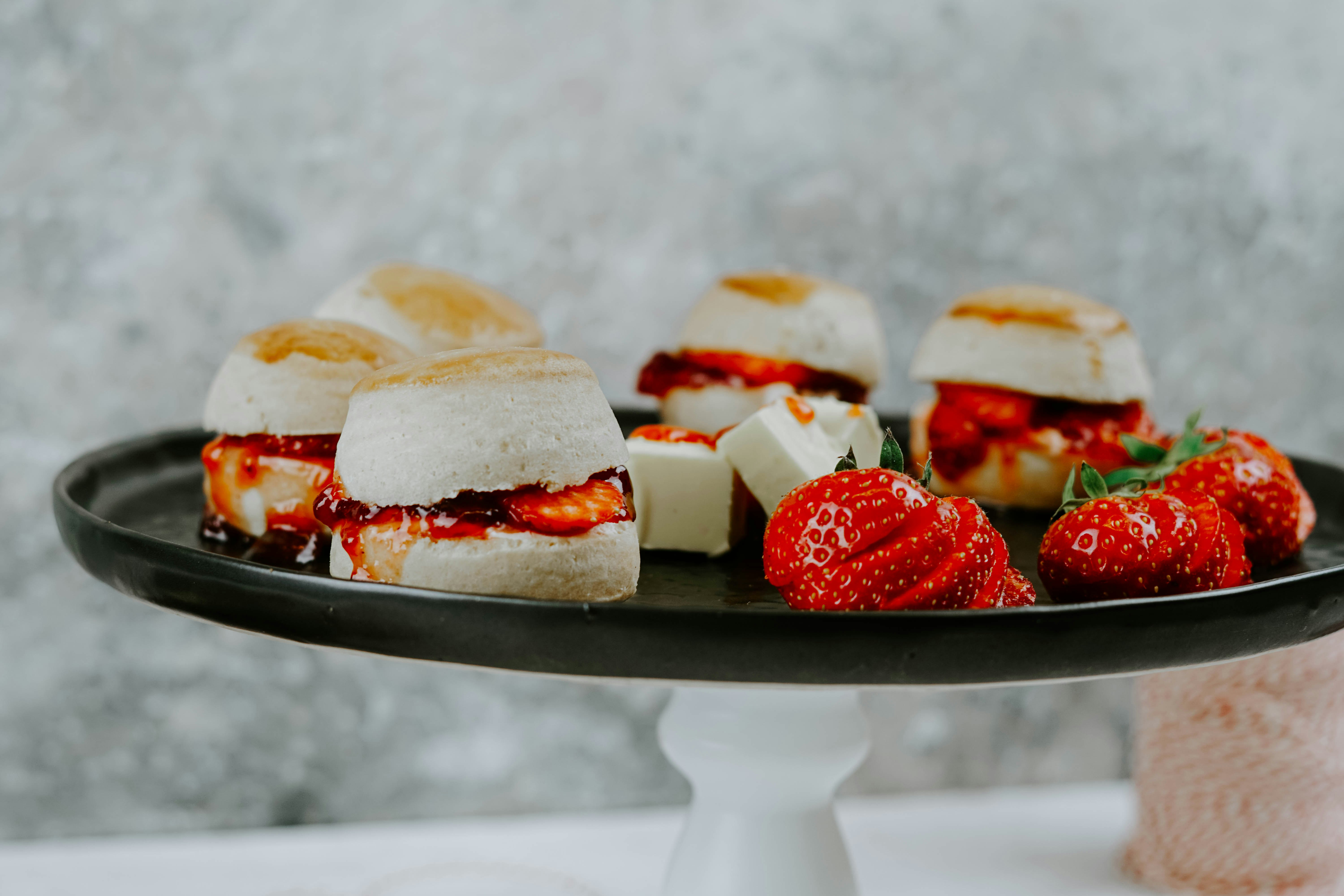 selective focus photography of pastry and strawberries on plate